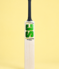 Wonder English willow cricket bat hero view on pastel yellow background