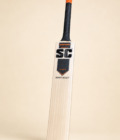 Super Select cricket bat detail view on pastel cream background